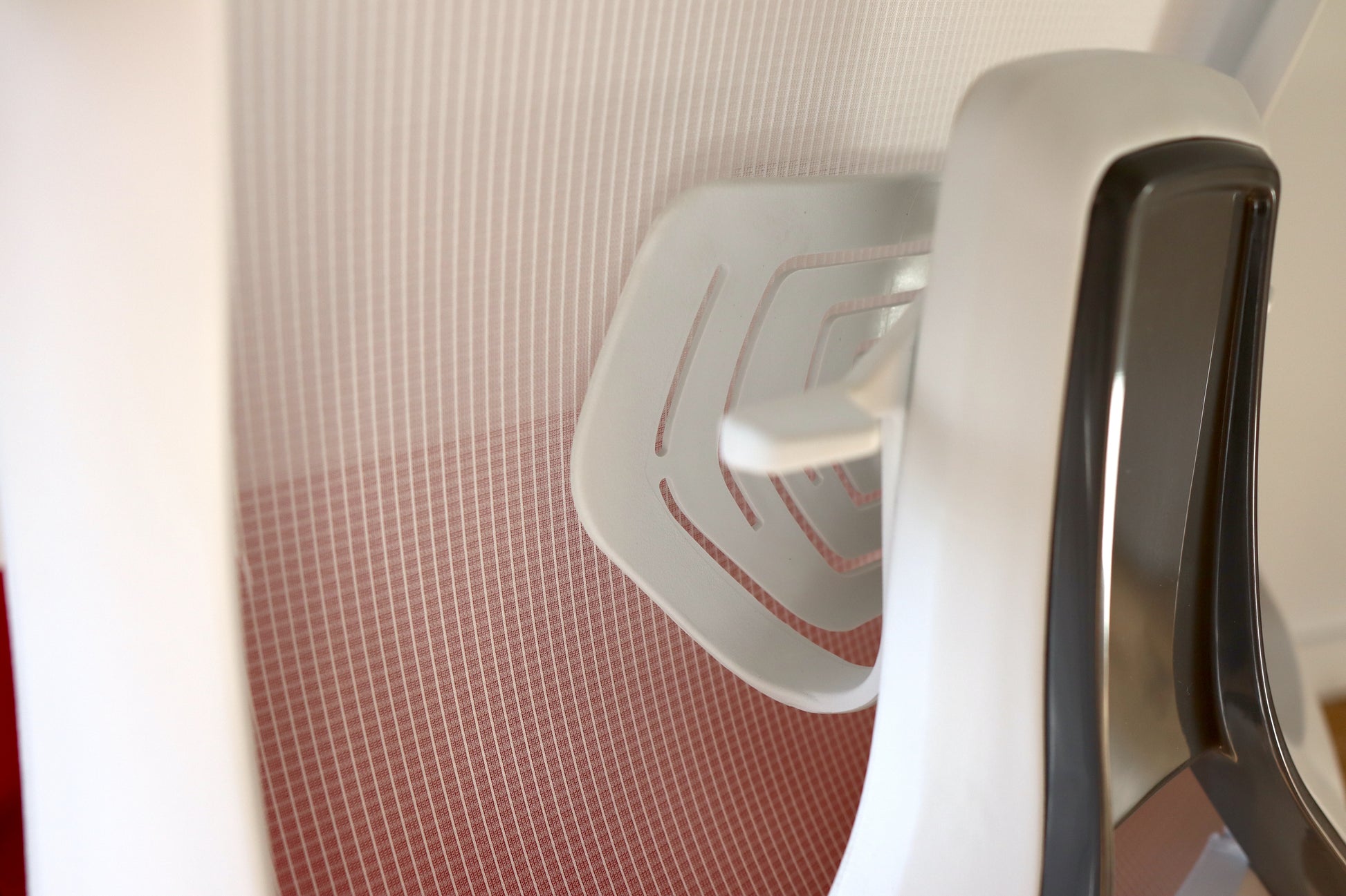 White ergonomic office chair adjustable lumbar support closeup