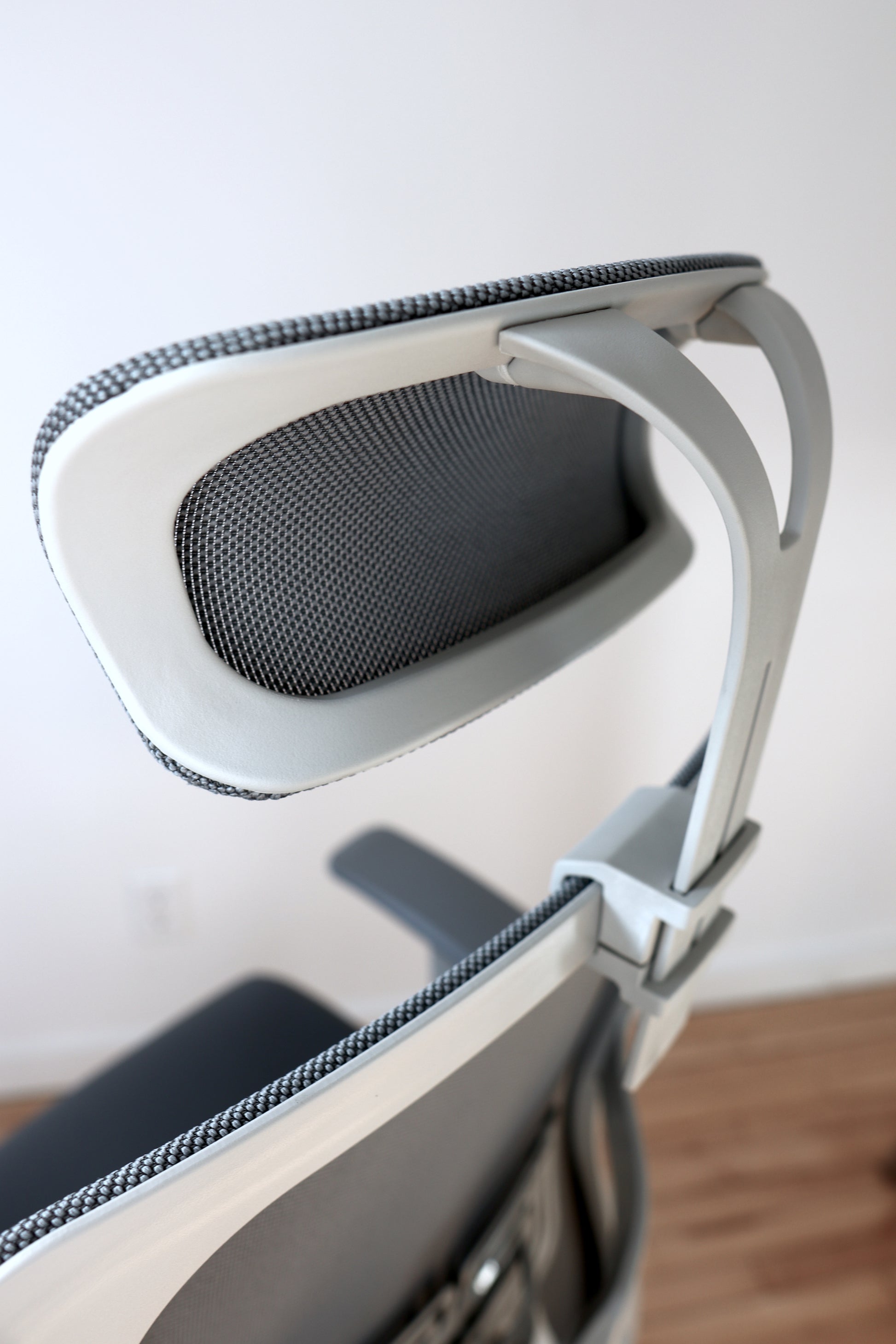 Adjustable office chair headrest with modern design closeup